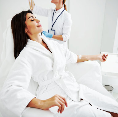 nurse setting up iv drip